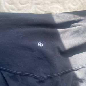 black lululemon leggings with velvet stripe on the sides
